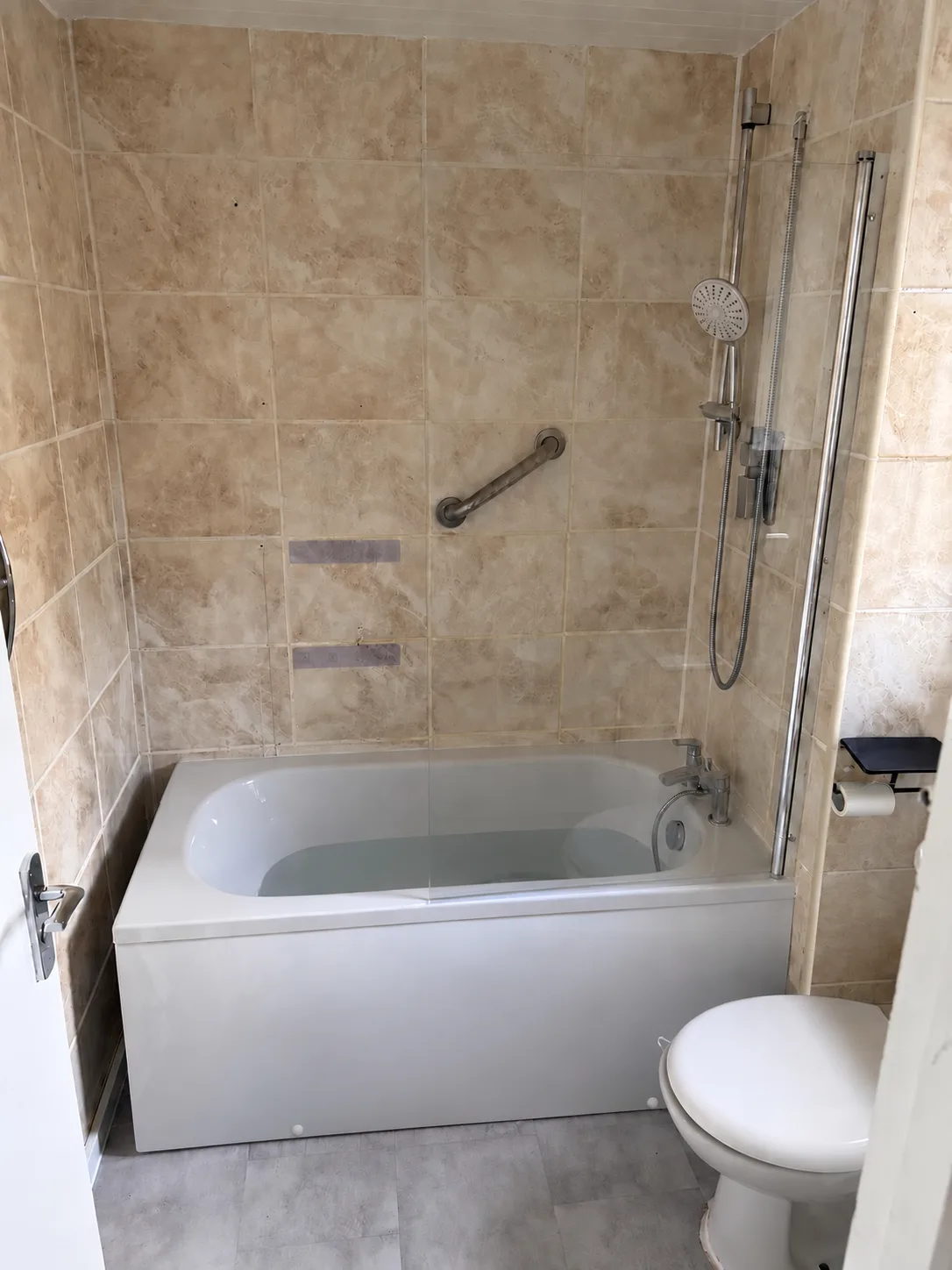 Completed bath and over-bath shower installation with glass screen in Basildon SS13